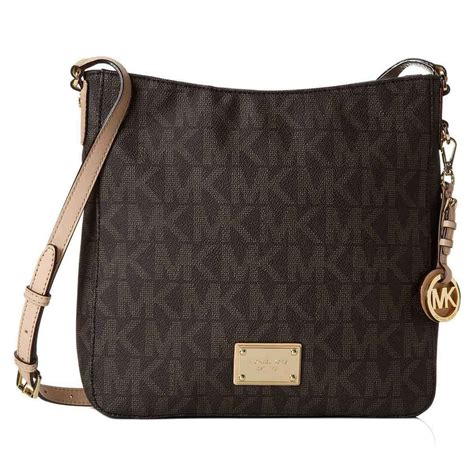 michael kors jet set large travel brown logo crossbody handbag|Michael Kors bag with airplanes.